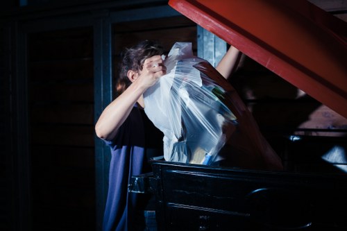 Eco-friendly skip being loaded with recyclable materials