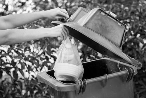 Technicians handling hazardous waste for safe disposal